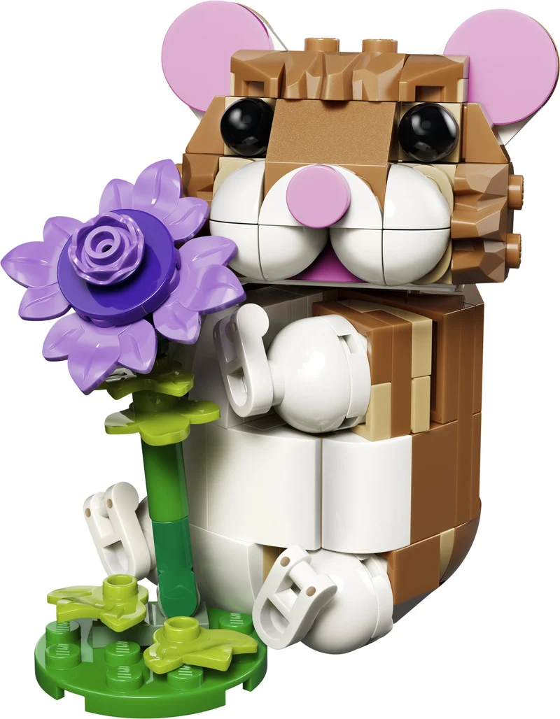 Le hamster mignon avec une fleur